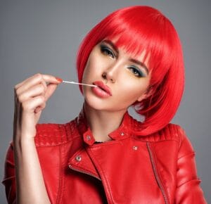 Beautiful sexy woman with bright red bob hairstyle. Fashion mod
